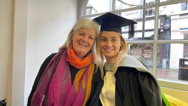 Penny Kite with her daughter, Sarah, at a degree ceremony in 2023
