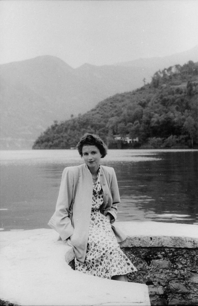 Woman beside a lake