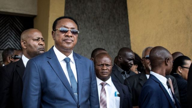 Prime Minister Bruno Tshibala standing with other officials