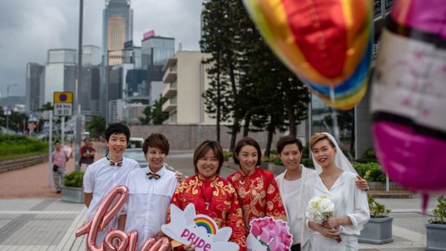 Same-sex couples attend an event to raise awareness of gay rights in Hong Kong on May 25, 2019, one day after Taiwan made history with Asia's first legal gay weddings.