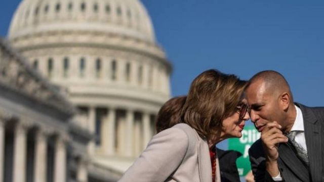 Hakeem Jeffries and Nancy Pelosi debate in front of the Capitol