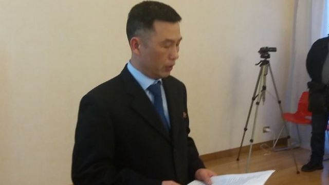 Jo Song-gil reads report at embassy reception in Rome in April 2018