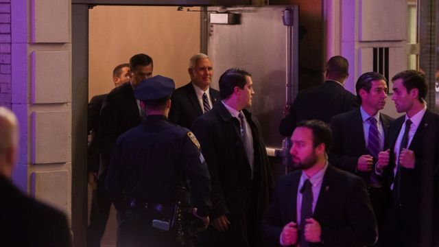 Vice President-elect Mike Pence, top centre, leaves the Richard Rodgers Theatre after a performance of "Hamilton," in New York, Friday, Nov. 18, 2016.