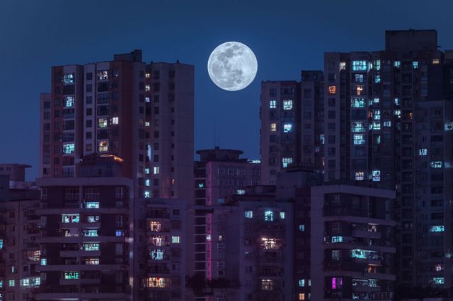 Residential buildings lit up by the supermoon in Chongqing, China