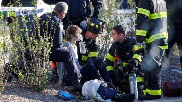 An injured woman is treated by first responders