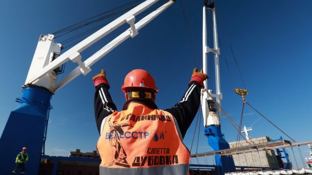 A ship arrives at the port of Sabetta to unload building materials for the Yamal LNG natural gas plant co-owned by Russia's Novatek, France's Total, China's National Petroleum Corporation and Silk Road Fund, and undergoing the second and the third phases of construction to develop the Yuzhno-Tambeyskoye gas field on the Yamal Peninsula
