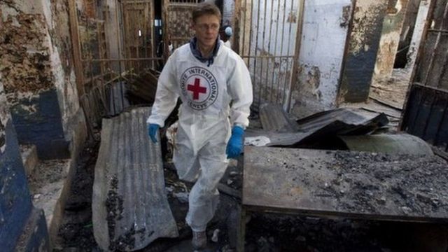 Dr Morris Tidball-Binz in a building in ruins after the 2010 Haiti earthquake