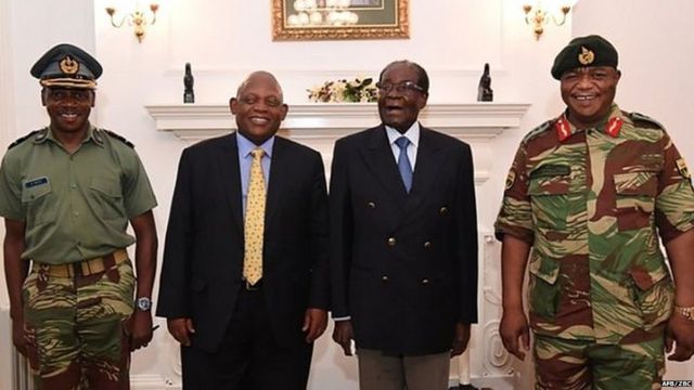 Mr Mugabe (second right) under house arrest, posing alongside Zimbabwe Defence Forces Commander General Constantino Chiwenga (right)