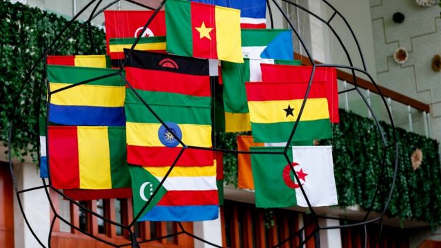 Flags wey dem hang during di event of di 2021 AFCON draws for Yaounde
