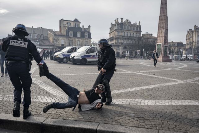 Riot police arrest a person during the demonstration against pension reform took place in Bordeaux on Thursday, March 23, 2022. There were several clashes between the demonstrators and the police, and at the end of the demonstration, trash fires were set