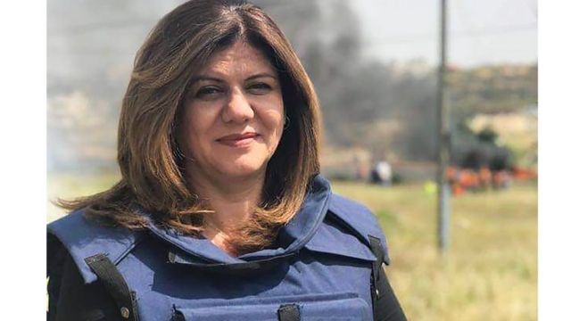 Sherine Abu Aqleh wears a jacket for journalists