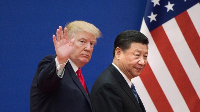 In this file photo taken on November 9, 2017 shows US President Donald Trump (L) and China"s President Xi Jinping leaving a business leaders event at the Great Hall of the People in Beijing.