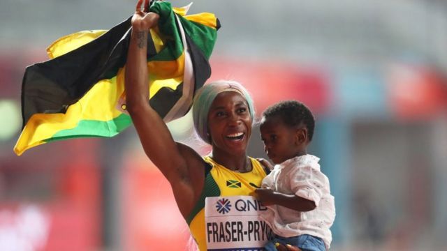 Shelley-Ann Fraser-Price with her son at the Doha 2019 IAAF World Athletics Championships