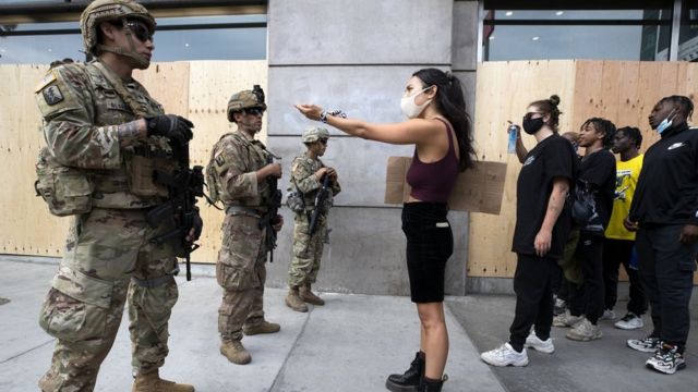 Demonstrators talk to the National Guard during a march in response to George Floyd"s death on June 2, 2020 in Los Angeles, California. (GETTY IMAGES)