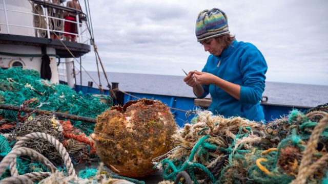 A researcher collecting waste in the Great Pacific Garbage Patch.
