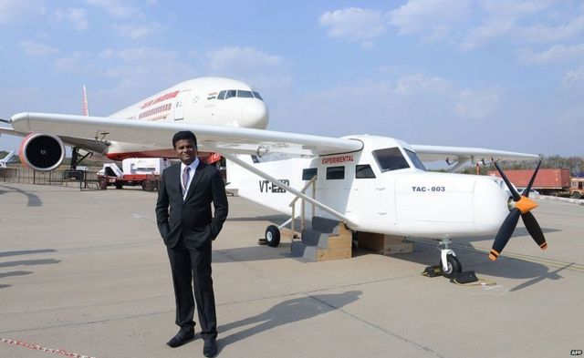 Indian pilot Captain Amol Shivaji Yadav poses beside his self- constructed TAC-003 aircraft at The India Aviation 2016 airshow at Begumpet Airport in Hyderabad on March 16, 2016. Yadav, a pilot with Jet Airways, has manufactured the aircraft which has been certified by Hindustan Aeronautics Limited (HAL), at his home in the western Indian city of Mumbai. The fifth edition of India Aviation, a five day event scheduled to run from March 16-20, more than 200 exhibitors from 12 countries.