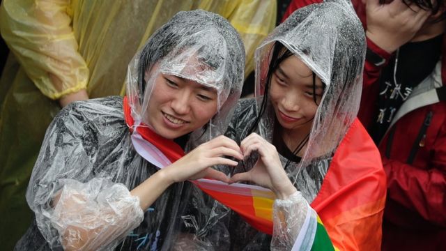 Supporters of same-sex marriage gather outside the parliament building as a bill for marriage equality is debated by parliamentarians in Taipei, Taiwan, 17 May 2019