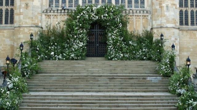 Flowers and foliage surround the West Door and steps of St George's Chapel at Windsor Castle