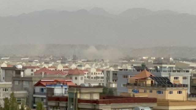 Smoke rises after two explosions reported outside Hamid Karzai International Airport.