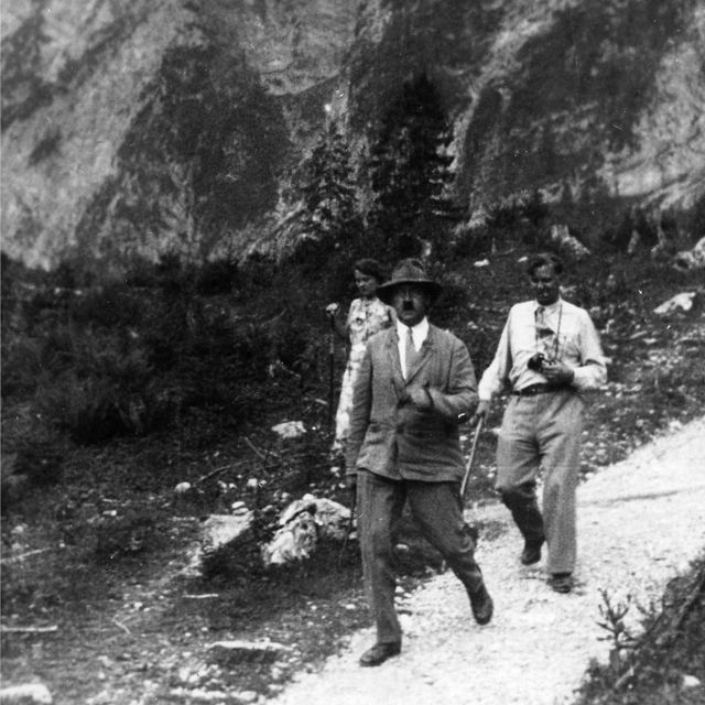 Geli Raubal with his uncle and a photographer walking through the countryside