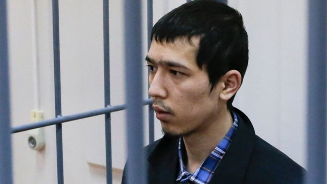 Abror Azimov in the defendant's cage at a court hearing in Moscow