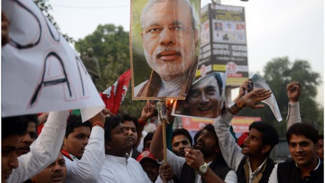 Indian activists from the Samajwadi Party burn a poster bearing the image of Indian Prime Minister Narendra Modi as they shout slogans against central government, and in support of Bollywood actor Amir Khan, who has spoken against what he has called growing intolerance and insecurity in India, in Allahabad on November 26, 2015. AFP PHOTO / SANJAY KANOJIA / AFP / Sanjay Kanojia (Photo credit should read SANJAY KANOJIA/AFP/Getty Images)