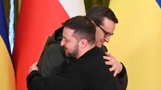 Ukraine's President Volodymyr Zelenskiy and Polish Prime Minister Mateusz Morawiecki hug