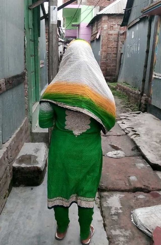 A sex worker in the alleyways of Bangladesh's Daulatdia brothel.
