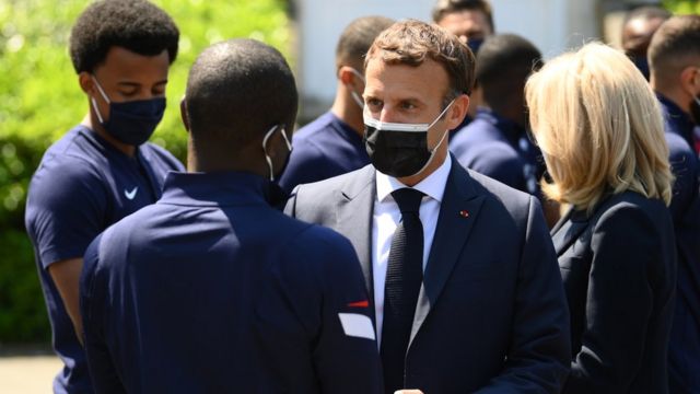 French President Emmanuel Macron (C) speaks with France's players before a lunch in Clairefontaine-en-Yvelines, France, 10 June 2021