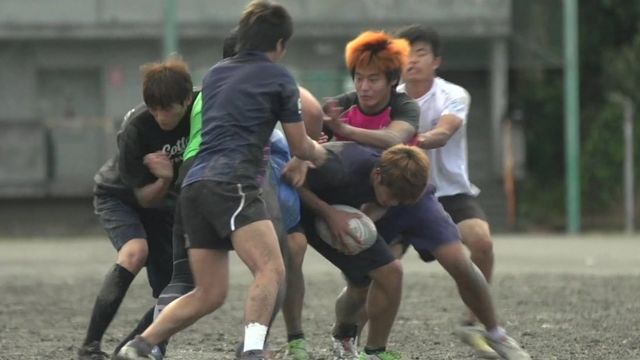 Young Japanese playing rugby