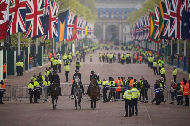 Mounted officers from the Metropolitan Police arrive on the Mall in London ahead of the Coronation of King Charles III and Queen Camilla
