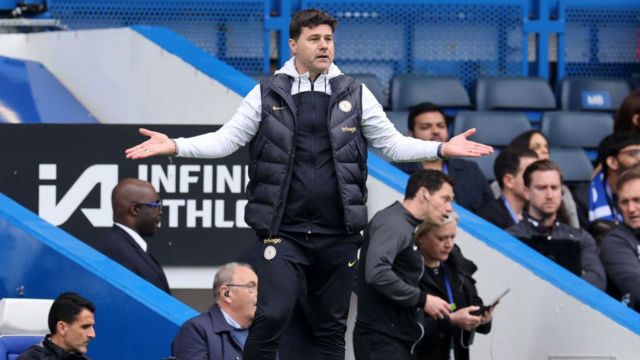 Mauricio Pochettino holds his hands out on the touchline
