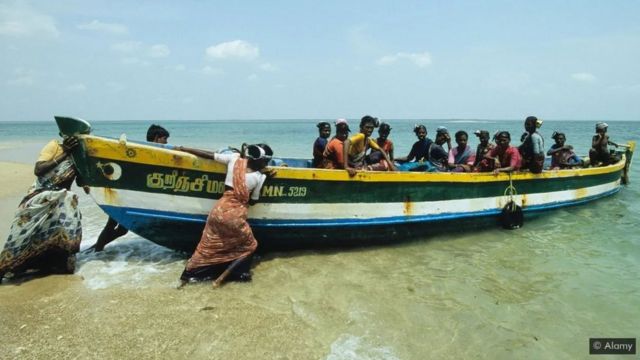 A boat with a number of people