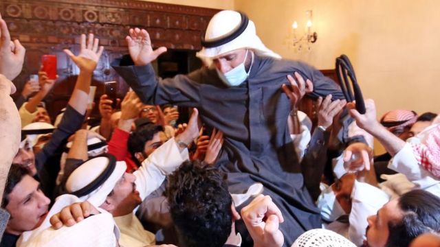 Former parliamentary speaker Marzouq Al-Ghanim is celebrating with his supporters.