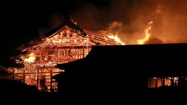 The main building of the Shuri Castle is seen on fire in Naha
