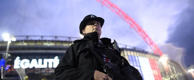 An armed police officer outside Wembley