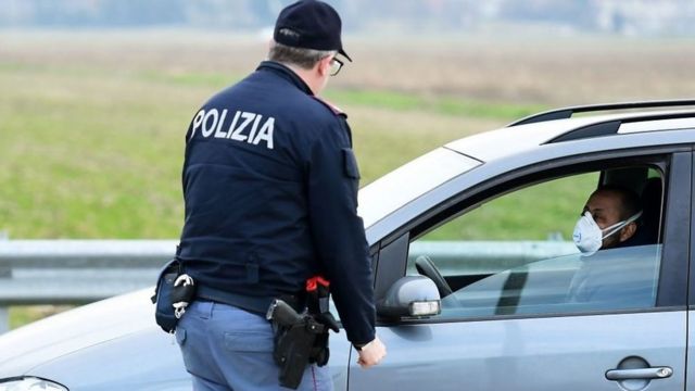 Italian police and person in car