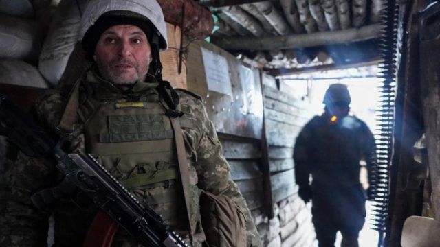 Ukrainian Servicemen are seen stationed outside of Zolote, Ukraine