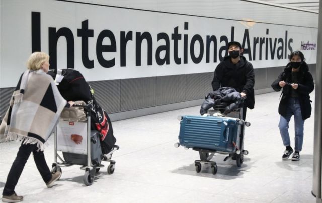 Passengers arrive at Heathrow Airport in London after the last British Airways flight from China touched down in the UK on Wednesday 29 January, 2020.