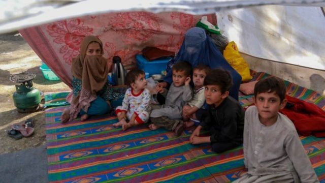 Afghan children who were displaced from other parts of the country live in temporary shelters at a camp in Kabul, Afghanistan, 09 October 2021