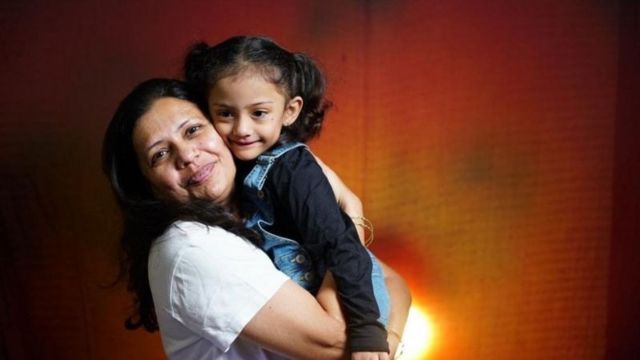 Gianna, now four years old, with her mother