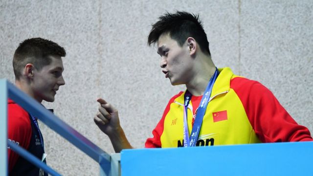 Sun Yang (R) of China speaks with Duncan Scott of Great Britain during the medal ceremony for the Men"s 200m Freestyle Final on day three of the Gwangju 2019 FINA World Championships at Nambu International Aquatics Centre on July 23, 2019 in Gwangju, South Korea.