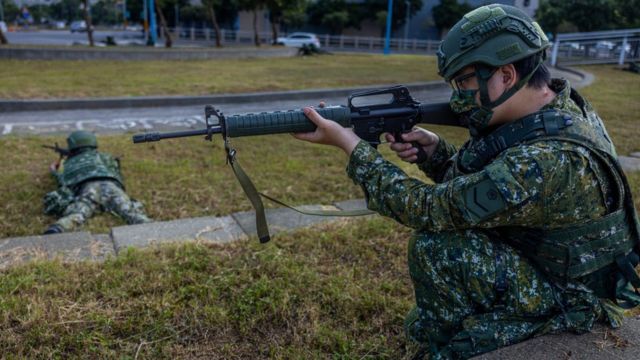A Taiwanese soldier aims with a rifle during the Han Kuang military exercise, which simulates China's People's Liberation Army (PLA) invading the island on July 27, 2022 in New Taipei City,