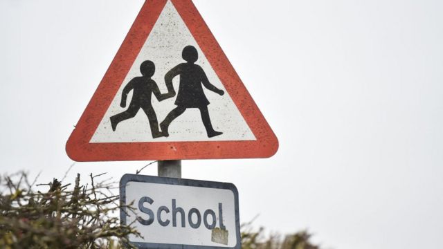 Iconic British road sign of two schoolchildren crossing updated by