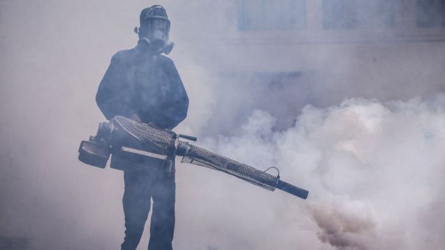 A health worker uses an anti-mosquito fumigation machine to control mosquitoes in Colombo, Sri Lanka. May 10, 2023