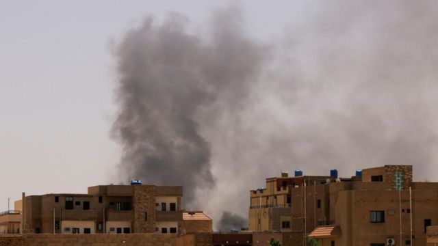 Smoke rises above buildings in the north of Khartoum