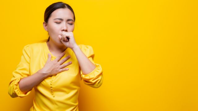 Woman coughing