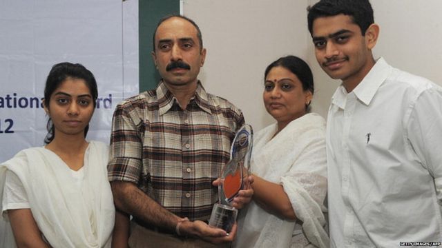 IPS Sanjiv Bhatt (2L) poses with his wife Shweta (2R), daughter Aakashi (L), and son Shantanu (R) after receiving the 5th Mother Teresa Award for Social Justice in Ahmedabad on December 31, 2012.