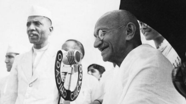 Indian statesman and activist Mohandas Karamchand Gandhi (1869 - 1948) speaking into a microphone at Pune, 1944.