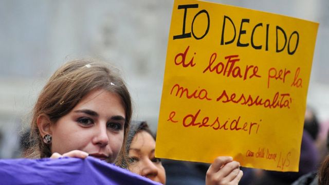 A woman holds a banner reading ''I decide'' during a demonstration in central Rome against a reform of the Spain's abortion law proposed by the conservative government on February 1 , 2014.
